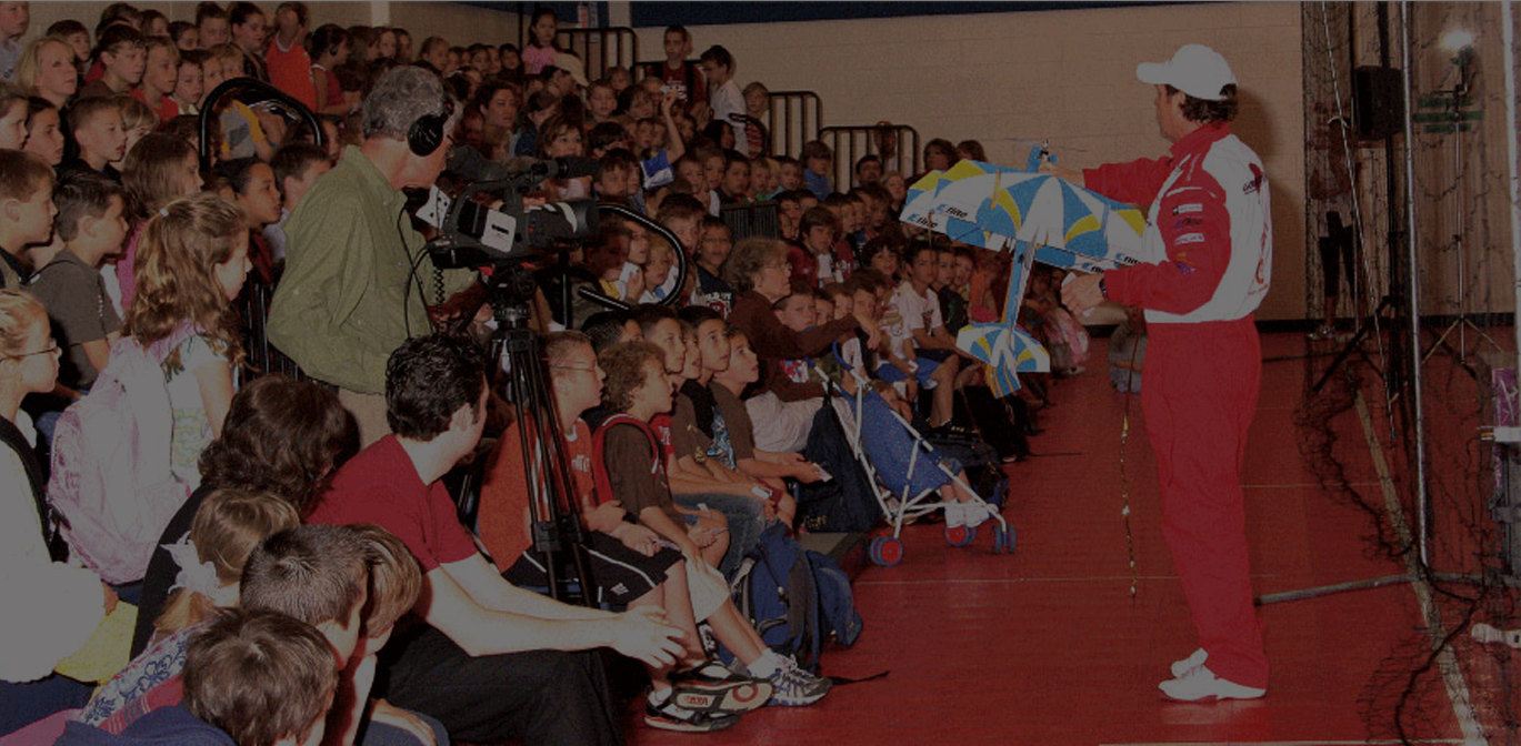 Students watching a live Litespeed indoor aircraft demonstration